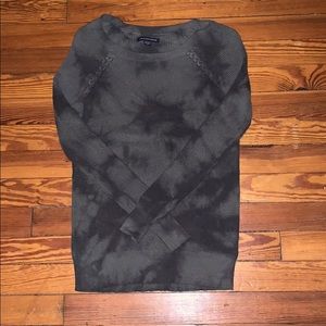 American Eagle Outfitters green sweater.